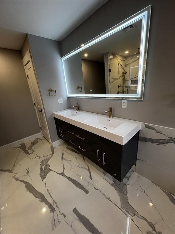 1 Harvard Ave, Burlington, MA 01803 - full bath with double vanity, marble finish flooring, and a marble finish shower