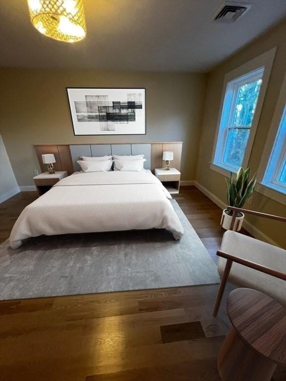 1 Harvard Ave, Burlington, MA 01803 - bedroom featuring baseboards and wood finished floors