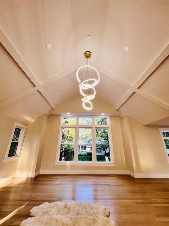 1 Harvard Ave, Burlington, MA 01803 - bonus room featuring wood finished floors, a chandelier, and lofted ceiling