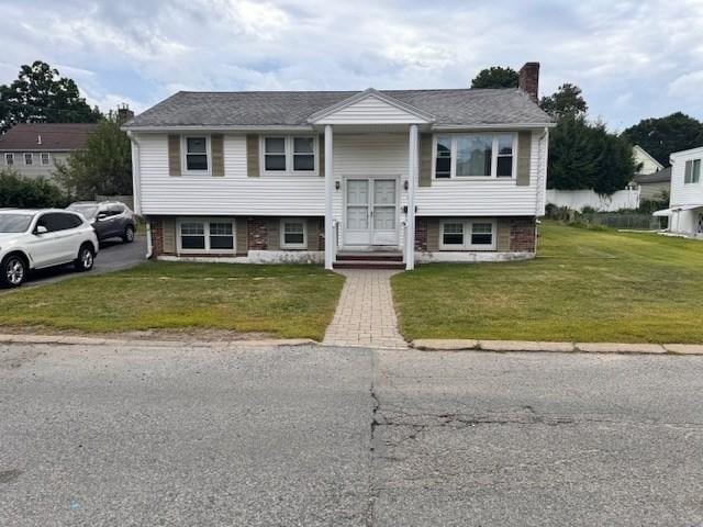 139 Westmoor Rd, Boston, MA 02132 - bi-level home with a chimney and a front yard