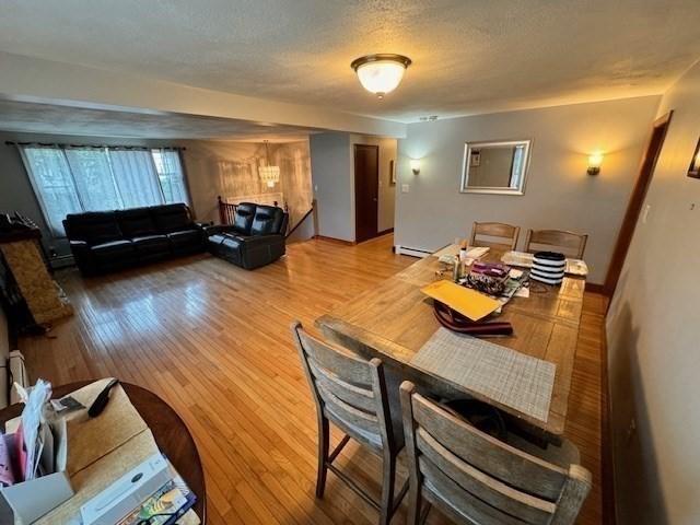 139 Westmoor Rd, Boston, MA 02132 - living room featuring wood finished floors and a textured ceiling