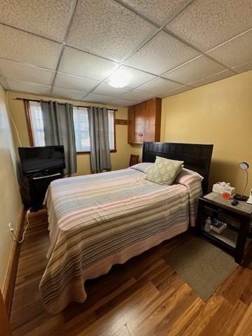 139 Westmoor Rd, Boston, MA 02132 - bedroom featuring a drop ceiling and wood finished floors
