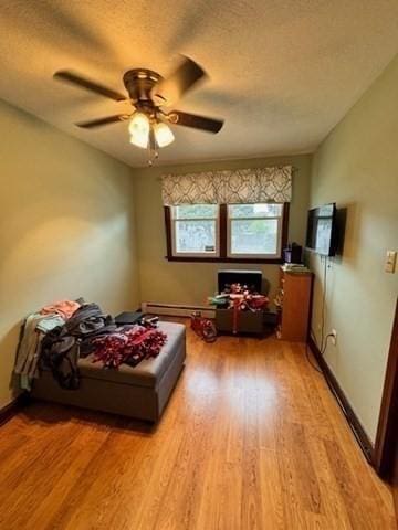 139 Westmoor Rd, Boston, MA 02132 - bedroom featuring light wood-style flooring, a textured ceiling, and a ceiling fan