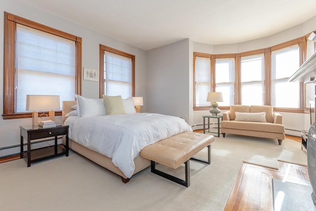 bedroom featuring a baseboard heating unit