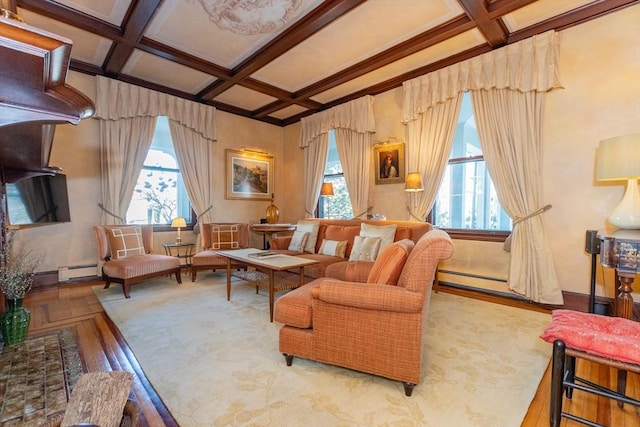 sitting room featuring plenty of natural light, baseboard heating, and coffered ceiling