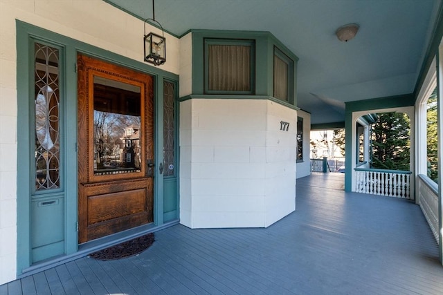 doorway to property featuring a porch