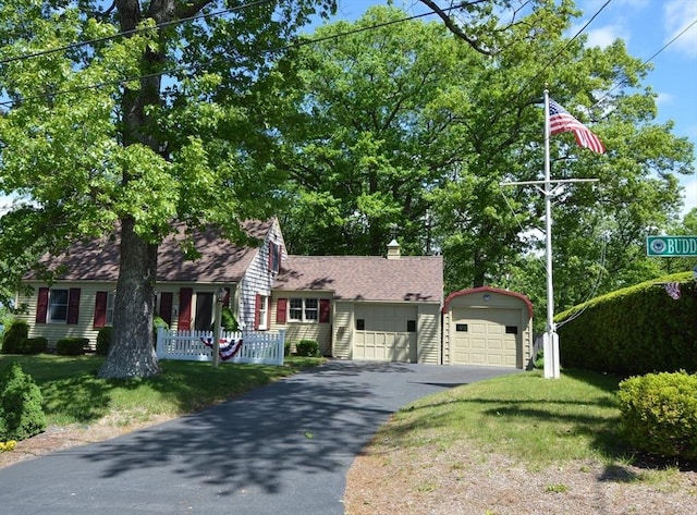 22 Buddy Kearney Ln, Millis, MA 02054 - view of front of property with driveway, a front lawn, roof with shingles, and a garage