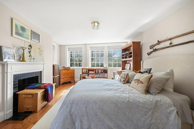 bedroom with wood-type flooring