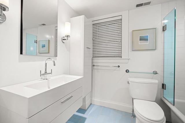 full bathroom with vanity, shower / bath combination with glass door, and toilet