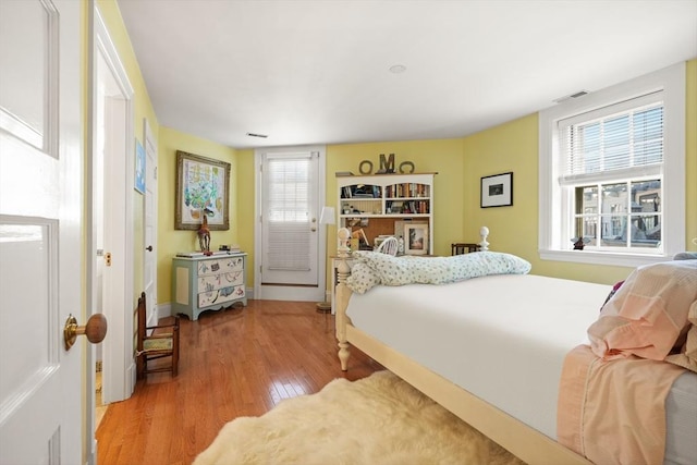 bedroom with hardwood / wood-style flooring