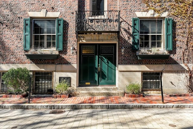 entrance to property with a balcony