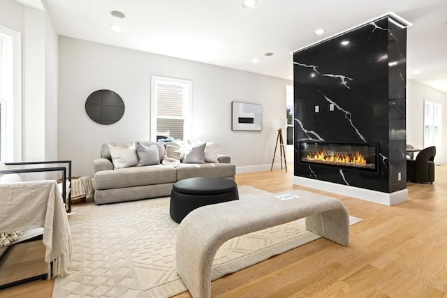 45 Sargent Ave, Somerville, MA 02145 - living room with wood finished floors, a fireplace, baseboards, and recessed lighting