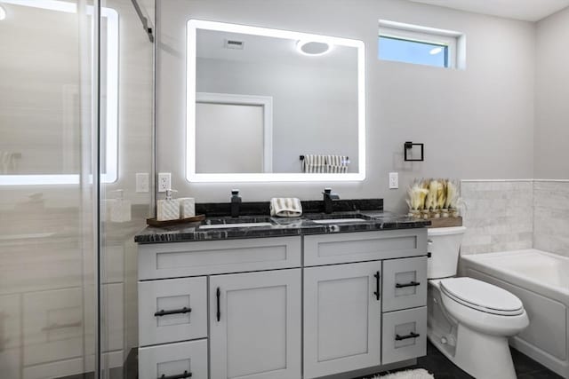45 Sargent Ave, Somerville, MA 02145 - full bath featuring double vanity, toilet, a tub to relax in, and a shower with door