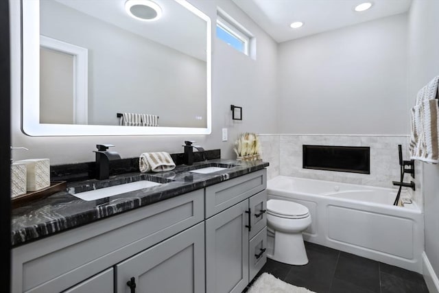 45 Sargent Ave, Somerville, MA 02145 - bathroom with tile patterned flooring, toilet, double vanity, a bath, and a premium fireplace
