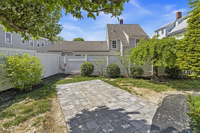 45 Sargent Ave, Somerville, MA 02145 - fenced backyard with a patio area