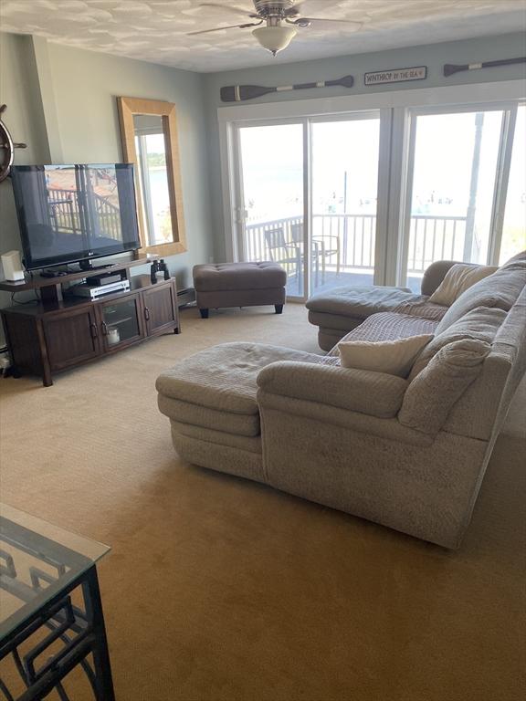 876 Shirley Unit 1, Winthrop, MA 02152 - living room with ceiling fan and light carpet