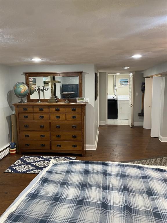 876 Shirley Unit 1, Winthrop, MA 02152 - bedroom with dark wood-style floors and washer / dryer