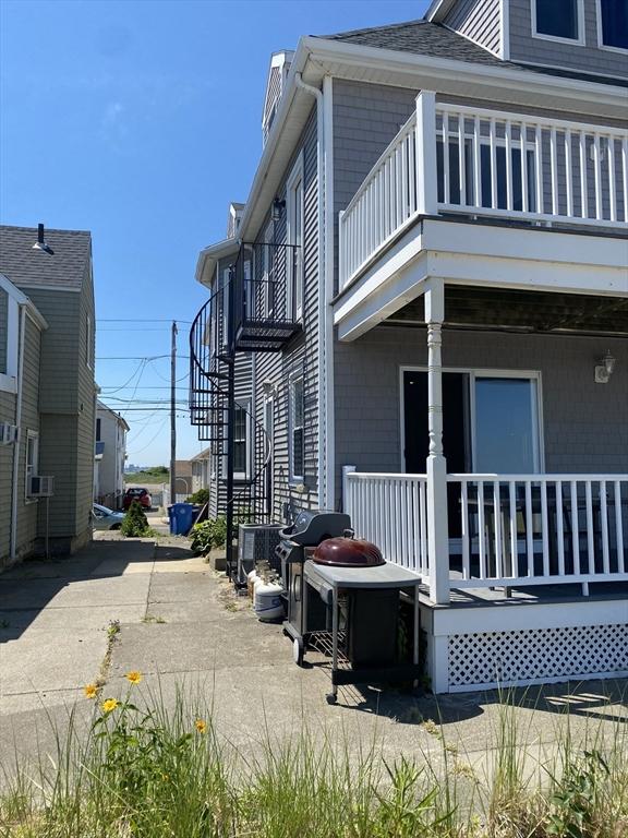 876 Shirley Unit 1, Winthrop, MA 02152 - view of home's exterior with a balcony, covered porch, and cooling unit