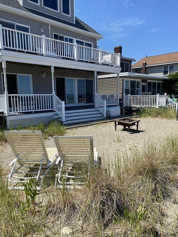 876 Shirley Unit 1, Winthrop, MA 02152 - rear view of house featuring an outdoor fire pit and a balcony