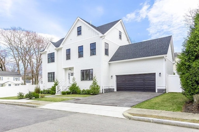 1 Marlin Rd, Boston, MA 02132 - view of front of property featuring an attached garage, fence, a shingled roof, board and batten siding, and driveway