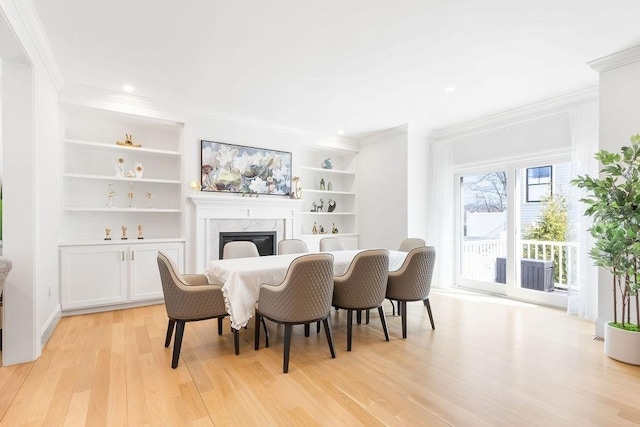 1 Marlin Rd, Boston, MA 02132 - dining area with crown molding, light wood-type flooring, a fireplace, and built in shelves