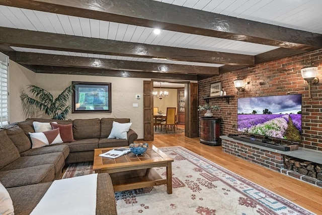 170 Atlantic Ave, Swampscott, MA 01907 - living area with wood finished floors, a chandelier, brick wall, and a wood ceiling with exposed beams