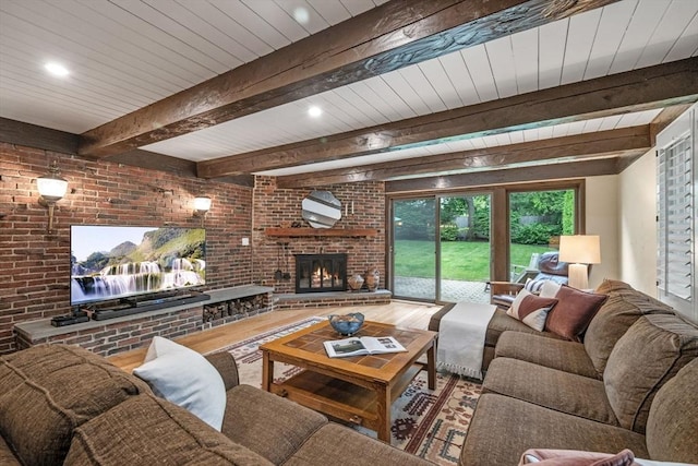 170 Atlantic Ave, Swampscott, MA 01907 - living room featuring beam ceiling, a brick fireplace, recessed lighting, brick wall, and wood finished floors