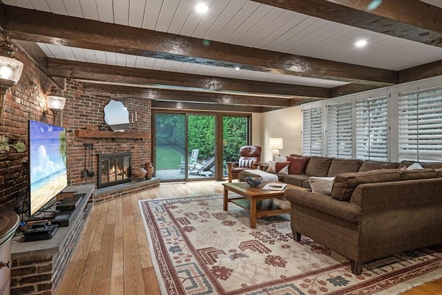 170 Atlantic Ave, Swampscott, MA 01907 - living area with hardwood / wood-style floors, a brick fireplace, brick wall, a wood ceiling with exposed beams, and recessed lighting