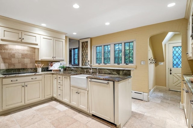 170 Atlantic Ave, Swampscott, MA 01907 - kitchen with cream cabinets, a peninsula, arched walkways, tasteful backsplash, and black electric stovetop