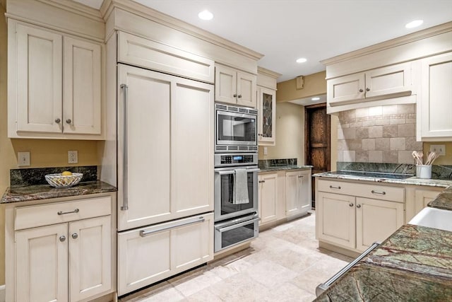 170 Atlantic Ave, Swampscott, MA 01907 - kitchen with built in appliances, a warming drawer, backsplash, recessed lighting, and dark stone counters