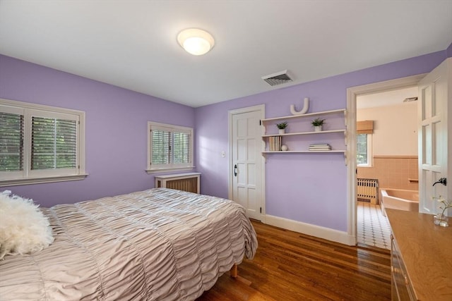 170 Atlantic Ave, Swampscott, MA 01907 - bedroom featuring wood finished floors, radiator heating unit, and a closet