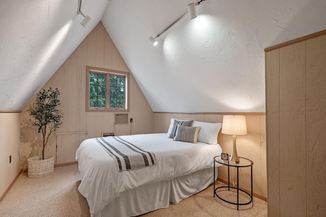 170 Atlantic Ave, Swampscott, MA 01907 - carpeted bedroom with rail lighting, vaulted ceiling, wooden walls, and an AC wall unit