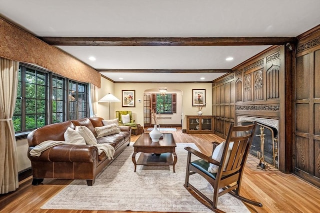 170 Atlantic Ave, Swampscott, MA 01907 - living room featuring light wood-type flooring, beam ceiling, a fireplace, arched walkways, and recessed lighting