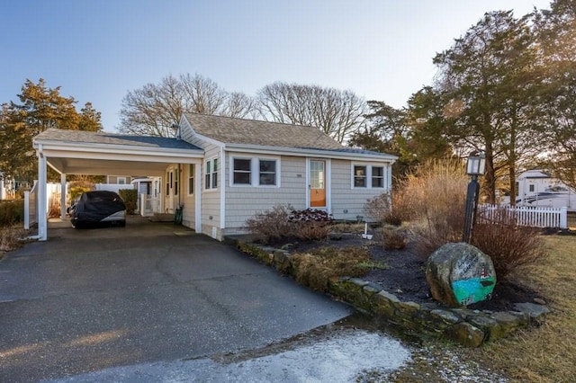 ranch-style home featuring a carport