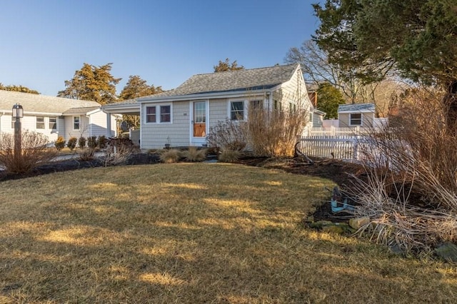 back of house featuring a yard