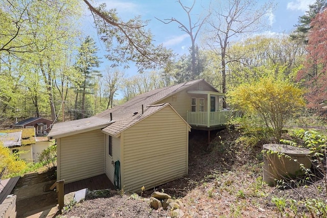 6 Hillside Rd, Holland, MA 01521 - view of side of property with a wooden deck and roof with shingles