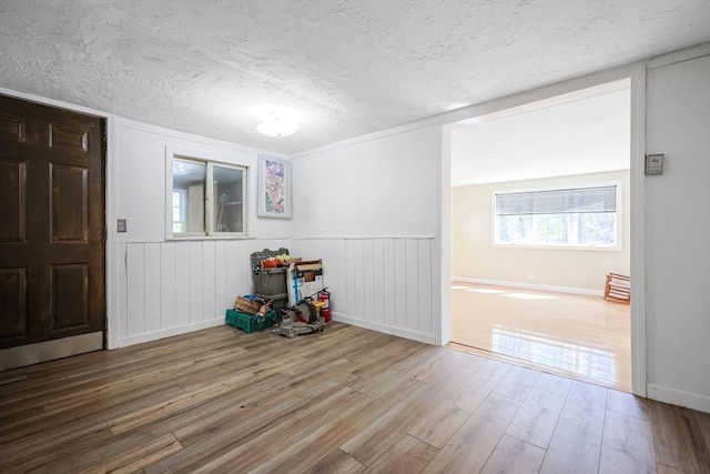 6 Hillside Rd, Holland, MA 01521 - spare room with wood finished floors, a textured ceiling, plenty of natural light, and baseboards