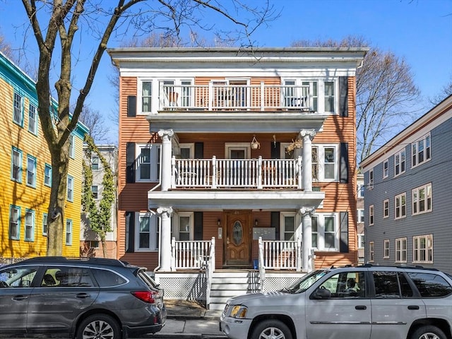 view of front of house with a balcony and a porch