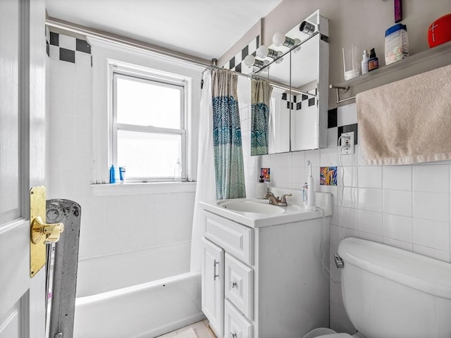 full bath with backsplash, toilet, shower / tub combo with curtain, vanity, and tile walls