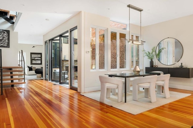 dining space featuring light wood-type flooring