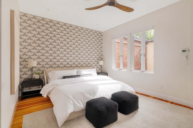 bedroom with hardwood / wood-style flooring and ceiling fan