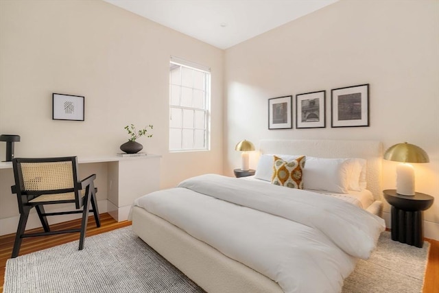 bedroom featuring wood-type flooring