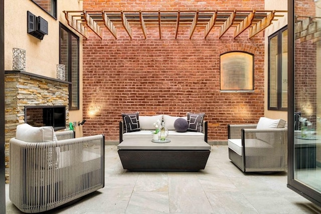 view of patio with a wall mounted air conditioner, a pergola, and an outdoor living space with a fireplace