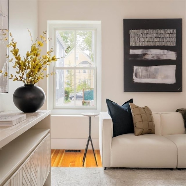 sitting room with hardwood / wood-style floors