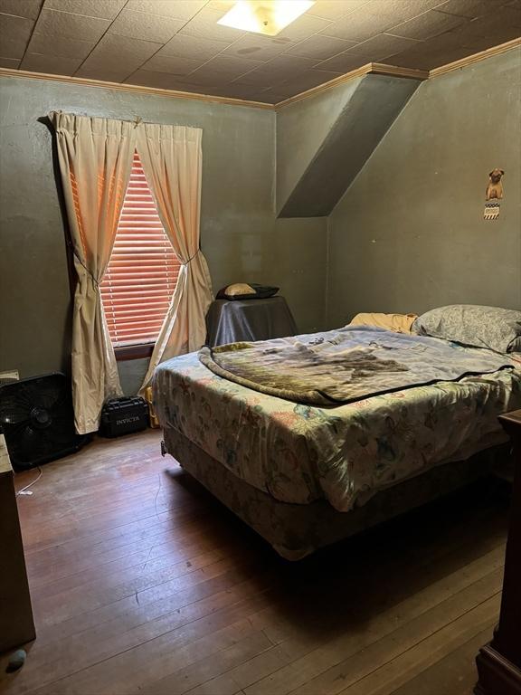 bedroom featuring hardwood / wood-style flooring