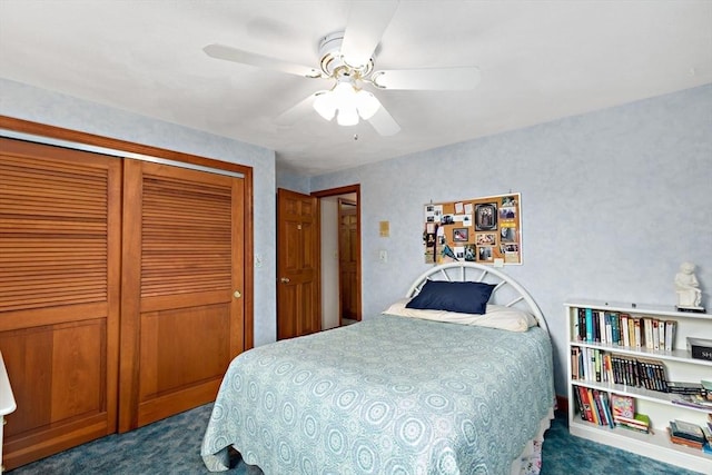 bedroom with dark carpet, a closet, and a ceiling fan