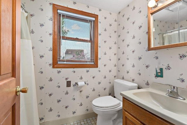 bathroom featuring wallpapered walls, toilet, vanity, baseboards, and a shower with curtain