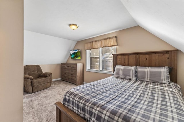 bedroom with light carpet and vaulted ceiling