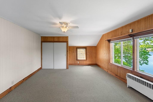 49 Bay View Dr, Shrewsbury, MA 01545 - bonus room featuring radiator, a ceiling fan, wood walls, light carpet, and baseboards