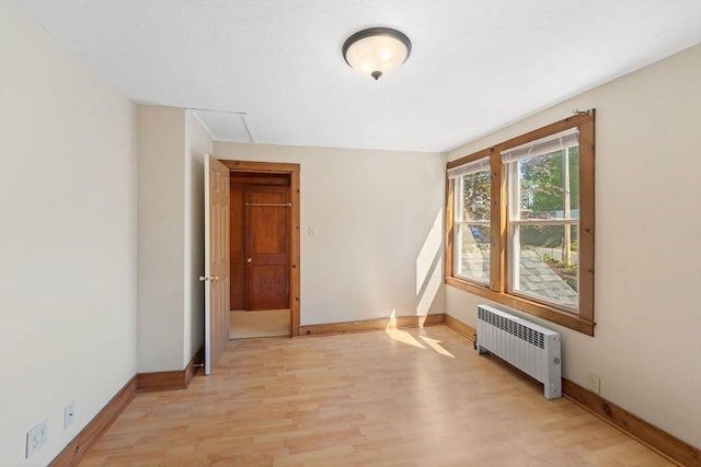 49 Bay View Dr, Shrewsbury, MA 01545 - unfurnished room with radiator heating unit, light wood-style floors, and baseboards